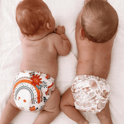 two babies playing whilst wearing their modern cloth nappies made in australia #color_matilda